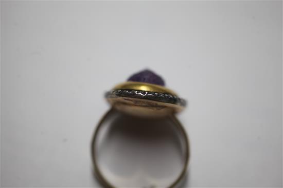 A 19th century amethyst glass? oval cameo ring, with rose cut diamond set border, (adapted?), size M.